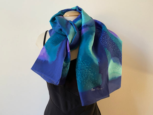Hand painted silk shawl in navy, teal and purple. Art to wear.