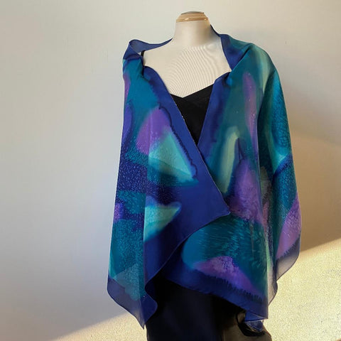 Hand painted silk shawl in navy, teal and purple. Art to wear.