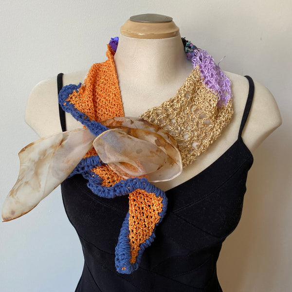 A unique scarf made from eco-dyed silk organza and a variety of threads, yarns and hand-painted silk strips. Art to wear.