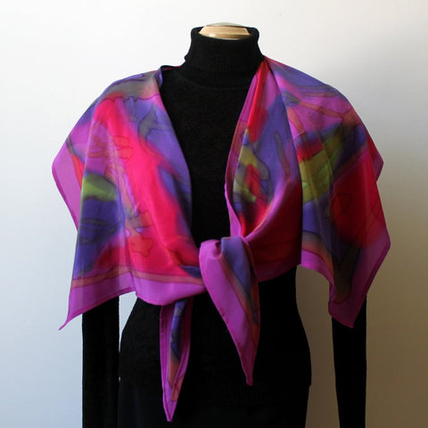 Handpainted silk wrap, poncho, scarf in bright fed, fuchsia, purple and green. Designer scarf. Art to wear.
