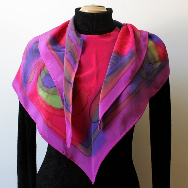 Handpainted silk wrap, poncho, scarf in bright fed, fuchsia, purple and green. Designer scarf. Art to wear.